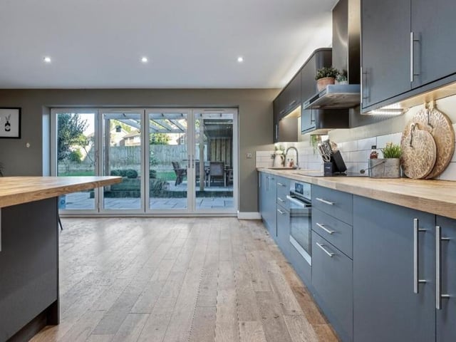 From top (an array of LED ceiling spotlights) to bottom (oak floor), the kitchen is a dream space for any family.