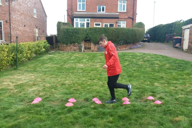 Tom Spriggs, aged 14, trains hard as part of the WhatsApp training programme