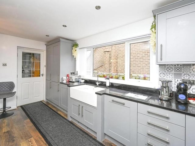 The kitchen is fitted with an array of integrated appliances, making it a dream for anyone who enjoys cooking and preparing meals.