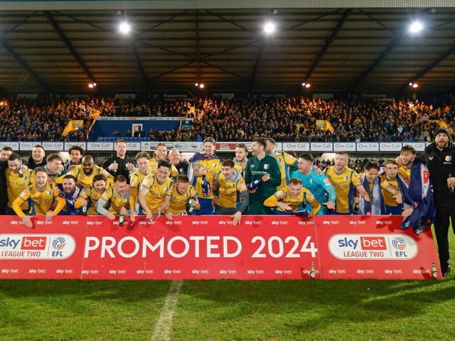 Mansfield Town's fans and players celebrated promotion to League One long into the night.