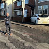 Councillor David Martin on Mansfield Road, Selston. He claims the council is responsible for the "worst road repair ever".