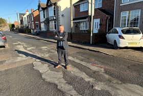 Councillor David Martin on Mansfield Road, Selston. He claims the council is responsible for the "worst road repair ever".