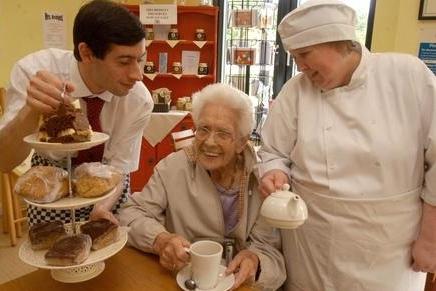 Regular customer Dolly Gozzard centre gets star treatment at Rumbles Cafe at Vicar Water. The cafe has reached the semi finals in the lottery fund awards.