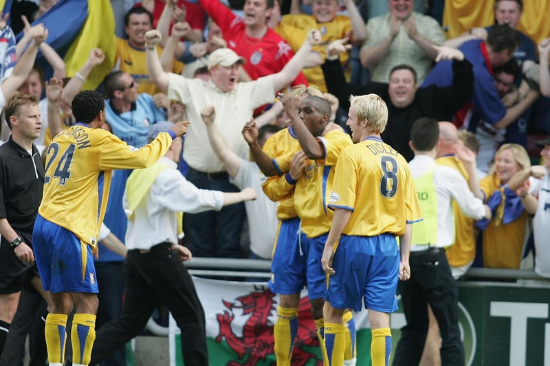 Mansfield town's fans and players celebrate a goal by Junior Mendes as Stags beat Northampton 2-0 in the Division Three first leg play-off on May 16, 2004.