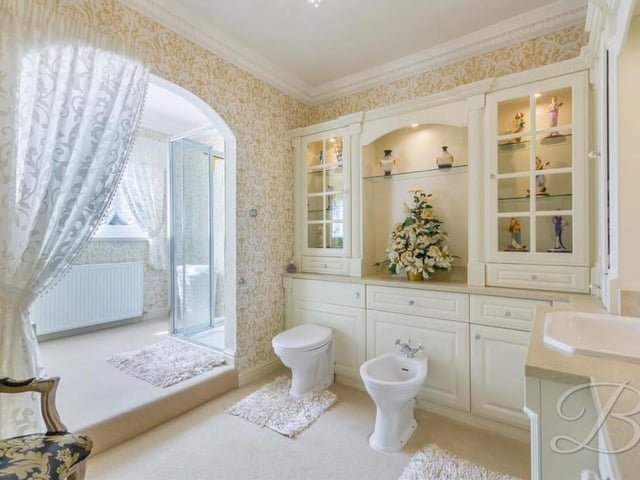 The family bathroom is full of tasteful touches. As well as the bath, there is a walk-in shower cubicle, low-flush WC, bidet, vanity hand-wash unit and fitted storage cabinets.