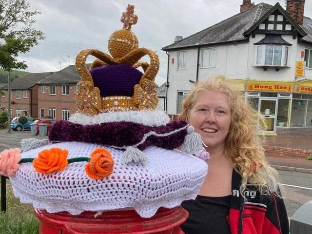 Becky Power with a crown topper she has made for a postbox at the junction of Mansfield Road and Vicars Court in Clipstone.