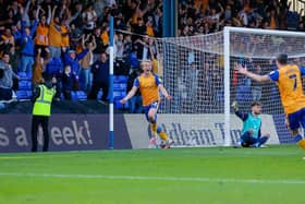 Delighted Mansfield Town midfielder George Lapslie celebrates his late winner against Oldham Athletic on Saturday. Photo by Chris Holloway/The Bigger Picture.media