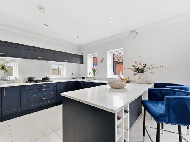 Integrated appliances include a fridge freezer, dishwasher and double oven