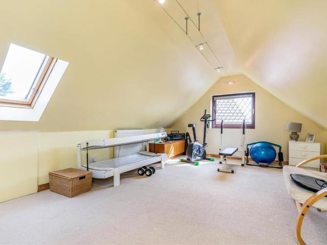 The sixth and final bedroom, which is on the second floor of the house, is so versatile it could also be used as a home office or even a gym. Two windows bring in plenty of natural light.