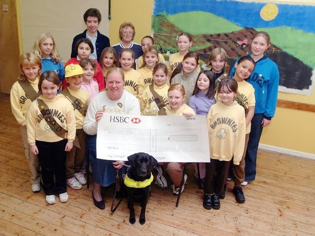 Blidworth Guides and Brownies presenting a cheque to Guide Dogs for the Blind
