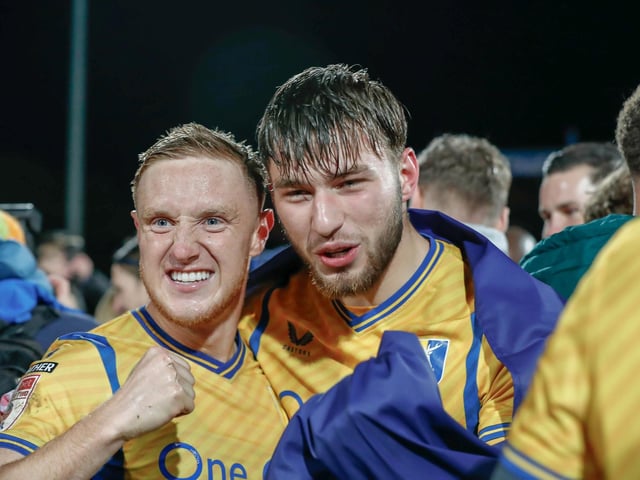 Mansfield Town's fans and players celebrated promotion to League One long into the night.