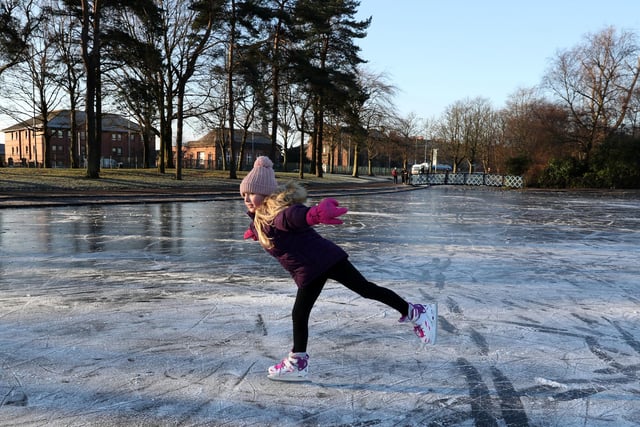 Isla Rose (9) skates on a frozen pond at Victoria Park in Glasgow.