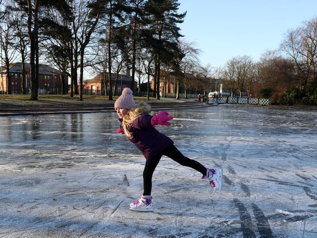Isla Rose (9) skates on a frozen pond at Victoria Park in Glasgow.