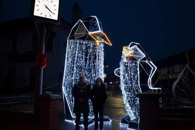 Coun Andy Meakin, Ashfield District Council chairman, with the two new penguin light figures
