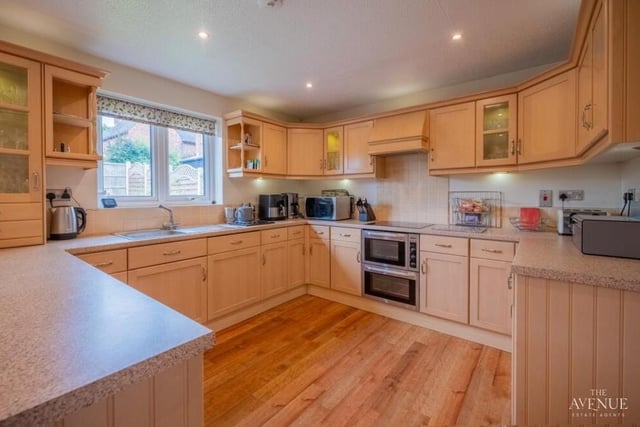 The fitted kitchen/diner is modern and boasts a welcoming feel. Matching units blend with essential appliances.