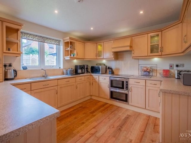 The fitted kitchen/diner is modern and boasts a welcoming feel. Matching units blend with essential appliances.