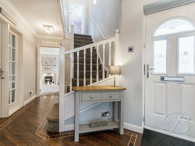 Time to check out the first floor now, so let's pass through the sizeable entrance hall, where there is an under-stairs cupboard, and climb the staircase to the landing, where there is another storage cupboard.