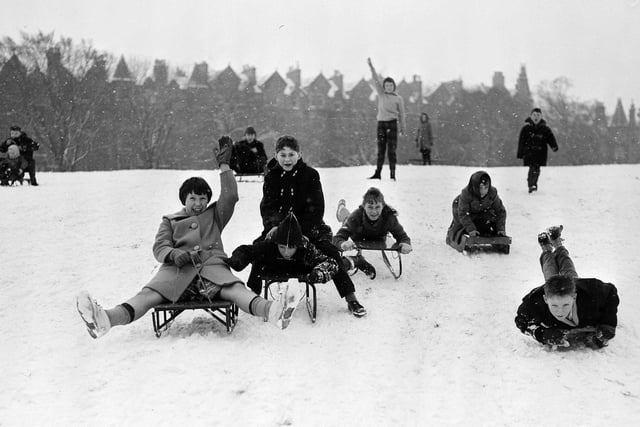 Snow in Edinburgh - Children sledging in the Meadows - Warrender Park Terrace in the background, 1961.
