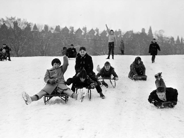 Snow in Edinburgh - Children sledging in the Meadows - Warrender Park Terrace in the background, 1961.