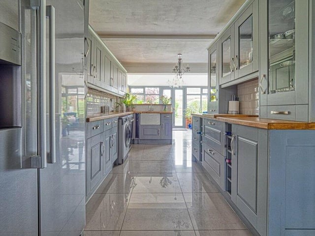Let's move on now to the extensive and updated kitchen, which features an abundance of storage cupboards. There is plumbing and space for a washing machine.