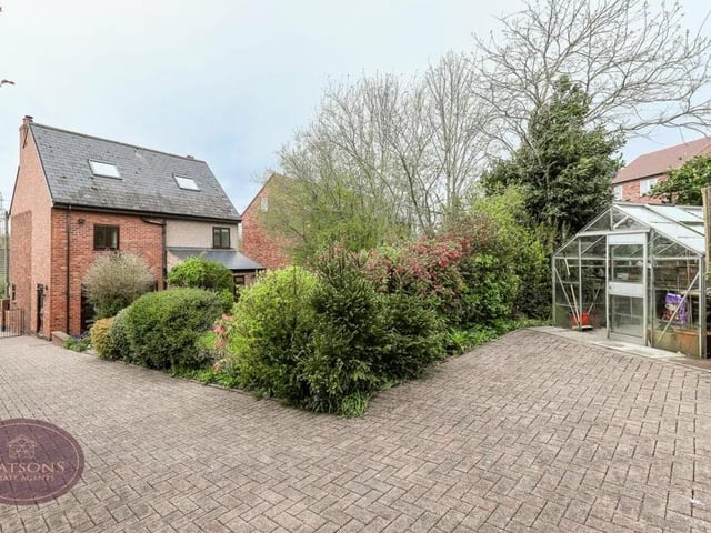 Nestled in the garden of the £475,000 property is this useful greenhouse.