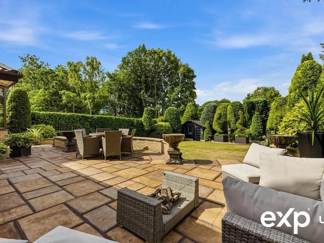A scenic patio accessible from the garden room and lounge, with a high level of privacy, is just the spot for outdoor furniture for relaxing or al fresco dining.
