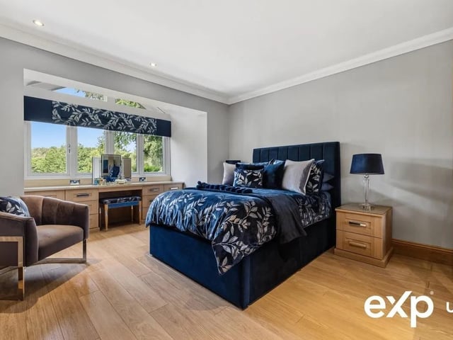 Storage is more than catered for i the principle suite with built-in bedroom furniture comprising wardrobes and a dressing table.