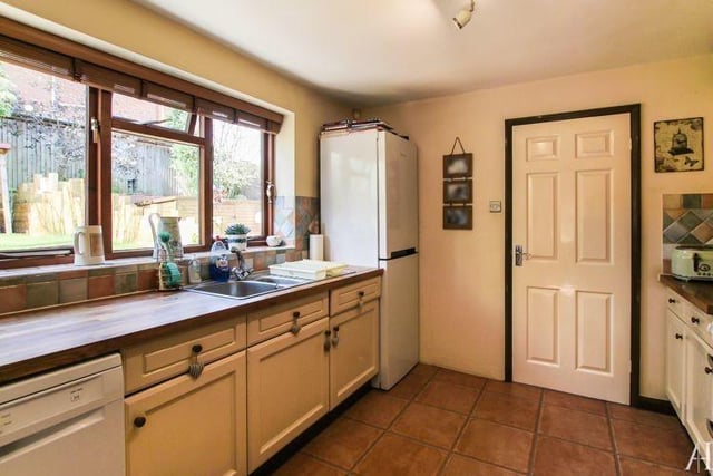A third shot of the kitchen. As you can see, there is room for appliances, including a fridge freezer. The floor is tiled, and there is a soft wood double-glazed window to the back of the £320,000 house.