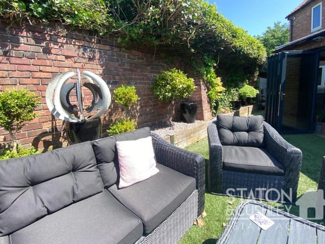 Sit down and relax with a cup of coffee, a pint of beer or a glass of wine in this lovely spot within the garden