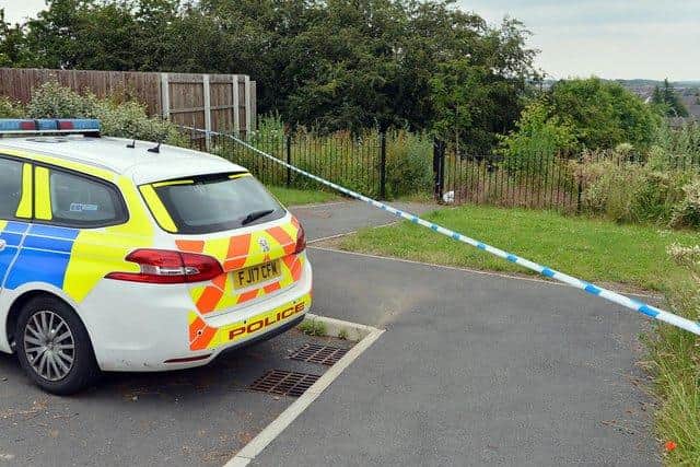 Police at the scene of the alleged assault
