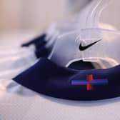The US sportswear firm Nike revealed it had altered the cross, the flag of England, using purple and blue horizontal stripes in what it called a "playful update" ahead of Euro 2024, which starts in June. (Photo by DANIEL LEAL/AFP via Getty Images)