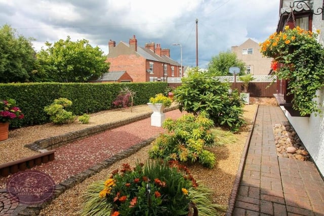 The front garden, shared by both the bungalow and the annexe, is beautiful. Well tended but low maintenance, it includes flowerbed borders, a range of mature plants and shrubs, and decorative gravel beds, all enclosed by wall and hedge borders.