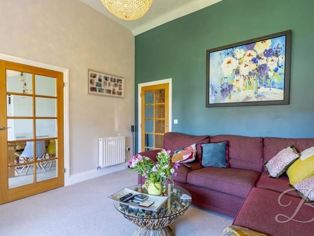 A second look at the comfortable living room. The double doors lead from the dining room.