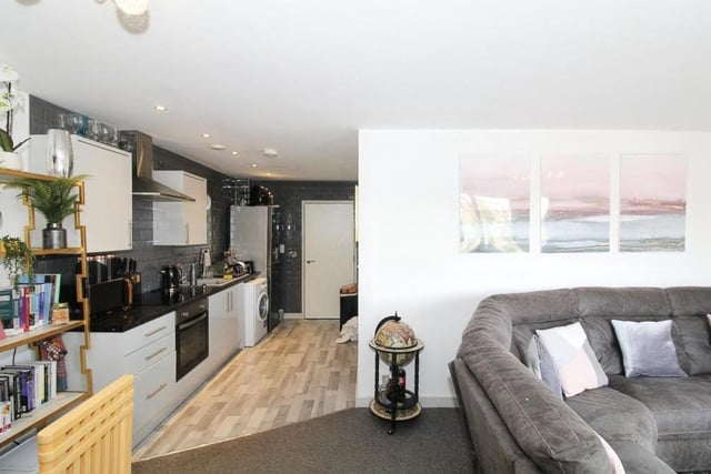 After its recent renovation, the open-plan living area, with lounge and kitchen, at the Stockwell Gate apartment is looking smart and stylish.
