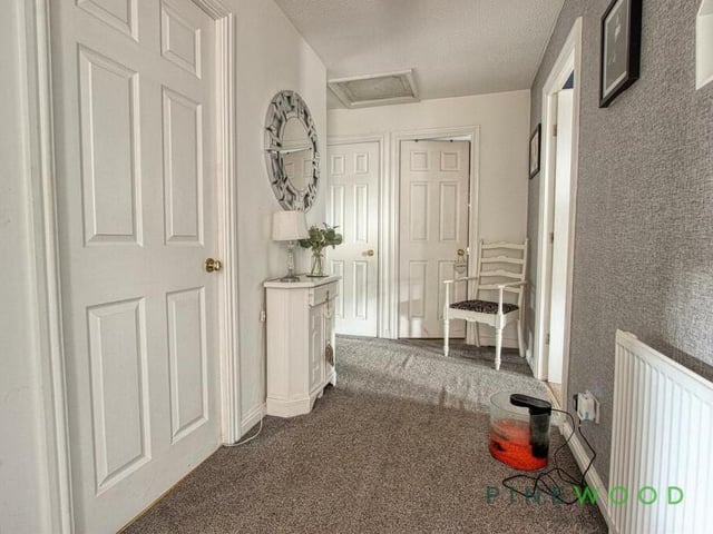 At the top of the stairs is this landing, which guides you to all four bedrooms.