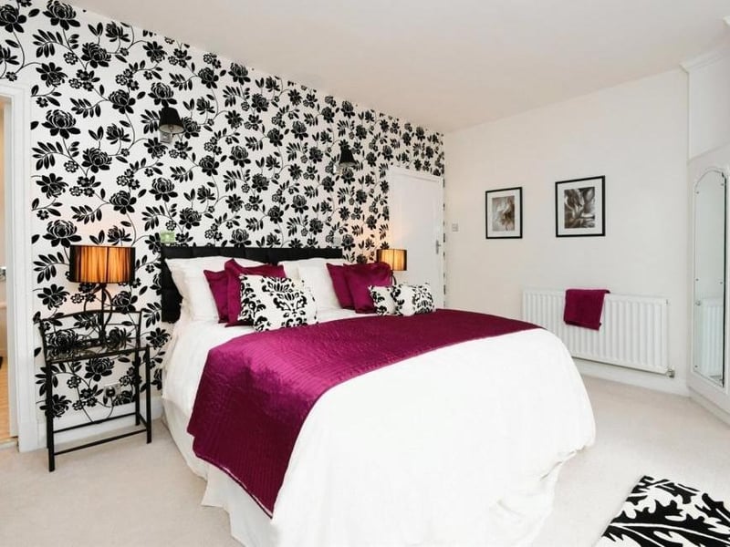 The second bedroom has double-glazed French doors leading straight into the back garden of the £750,000-plus property. There are also fitted wardrobes and overhead storage cupboards, plus direct access to the family shower room.