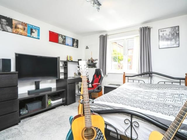 This bedroom is full of character and proves how someone can easily put their individual stamp on it. Overlooking the front of the house, there is a storage cupboard and carpeted floor.