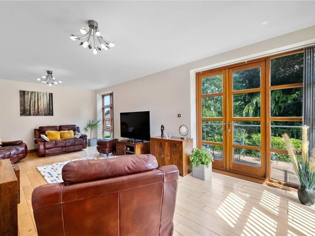 The luxurious lounge features doors leading onto the veranda and wooden flooring with zoned under floor heating.