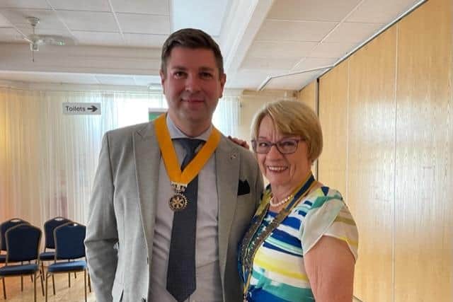 Rotarian Matt Harding with new Mansfield Rotary Club president Rotarian Karen Johnson.