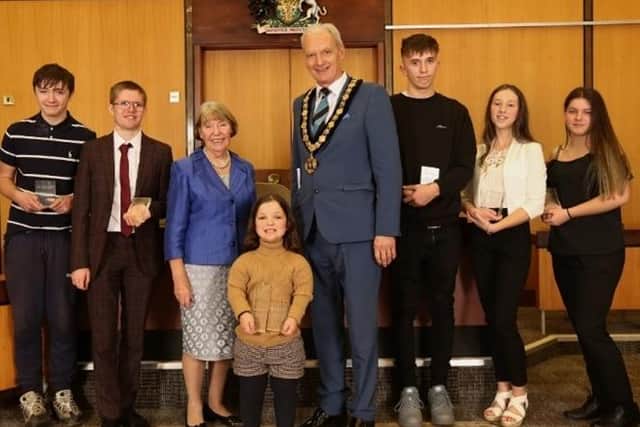 Coun Kay Cutts and Coun Kevin Rostance with winners at last year's awards ceremony
