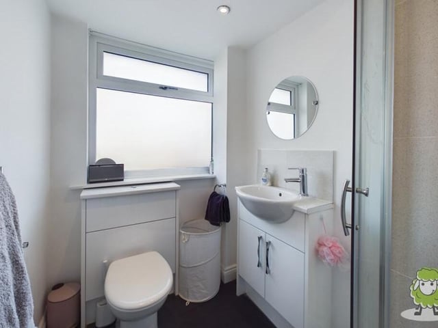 One of the bedrooms on the first floor of The Spinney has access to this en suite shower room.
