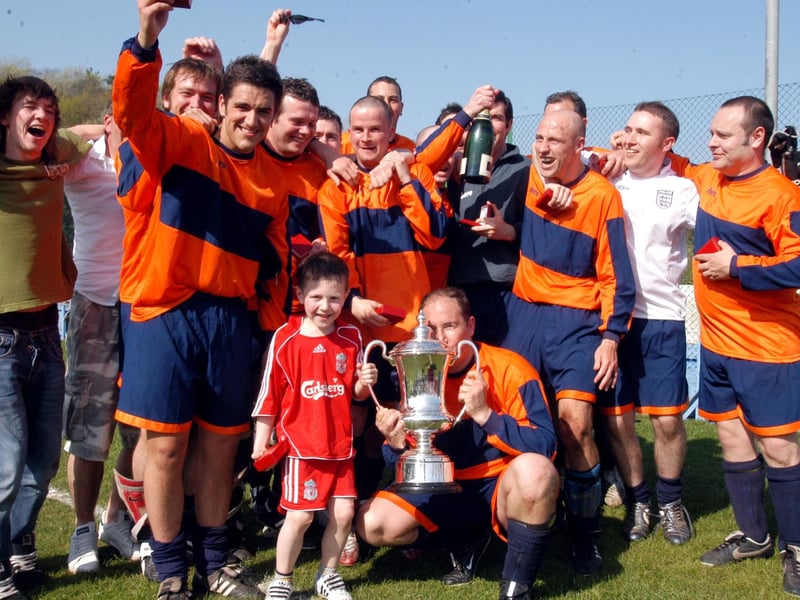 Celebrations for Portland Arms after victory over Forest Town in a Sunday League cup final.