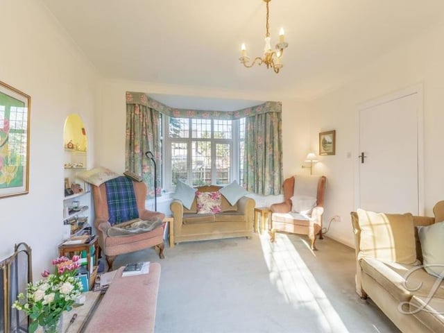 The lounge also features a wonderful bay window, facing the front of the house, at the opposite end to the French doors.