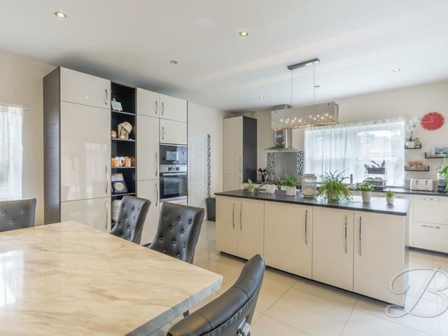 The kitchen diner is fitted with an extensive range of modern wall and base units with complementary worktop over, inset sink and drainer with mixer tap. Appliances include an integrated electric double oven, microwave and fridge/freezer. Downlights and a tiled floor add to the aesthetic appeal of the room.