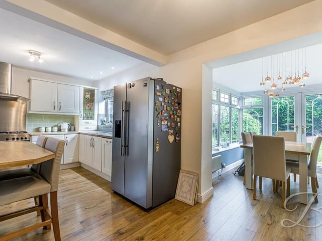 There is space within the kitchen for a dining or breakfast table, but the room also flows seamlessly into an open-plan conservatory and diner, as you can see to the right.