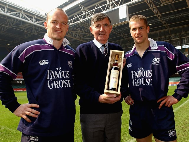 Bill McLaren is presented with a 50-year-old bottle of The Macallan whisky by Gregor Townsend and Chris Paterson in Cardiff ahead of his last Scotland commentary. McLaren began on BBC radio in 1953 and made the switch to television six years later.