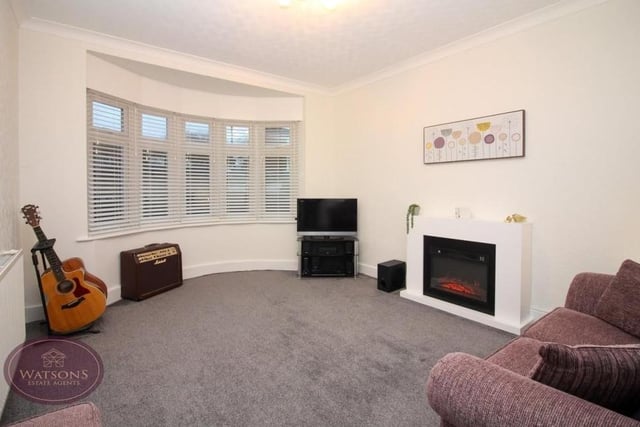 The main reception room at the Chewton Street bungalow is this pleasant lounge with uPVC, double-glazed bay window facing the front of the property.