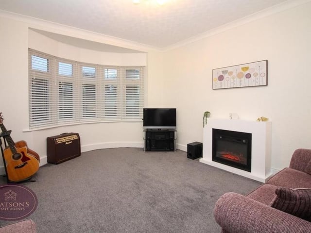 The main reception room at the Chewton Street bungalow is this pleasant lounge with uPVC, double-glazed bay window facing the front of the property.
