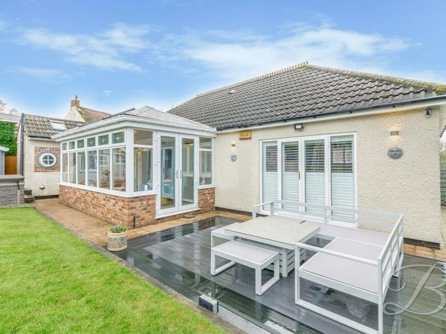 Here's a close-up of the pleasant outdoor seating area that the current owners enjoy in the back garden.