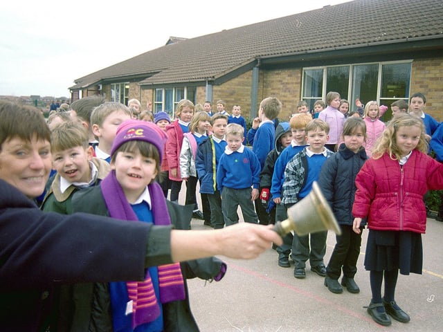 Forest Town's Holly Infants ringing their old school bell in 2001